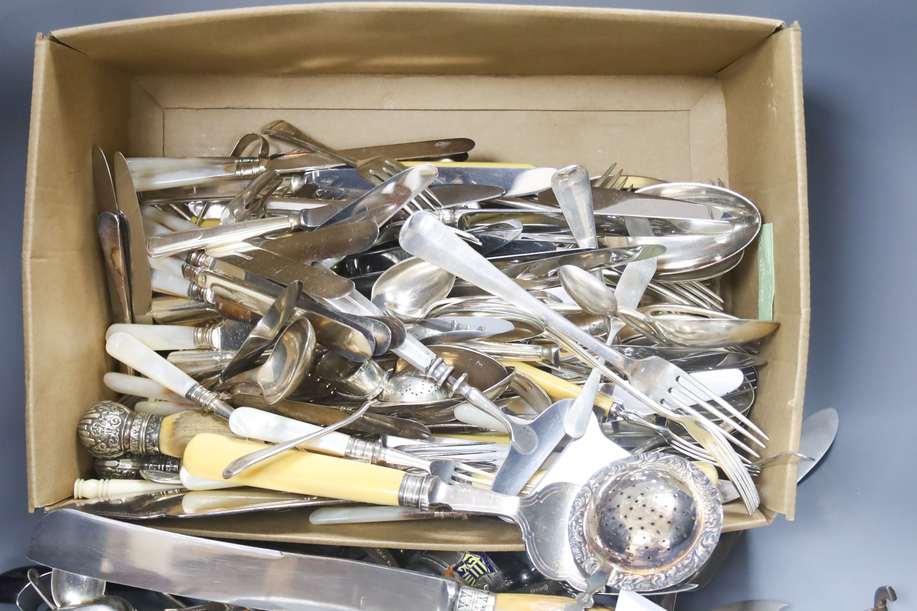 A quantity of silver plated flatware to include three piece stag horn handled ...... silver and mother of pearl handled dessert eaters